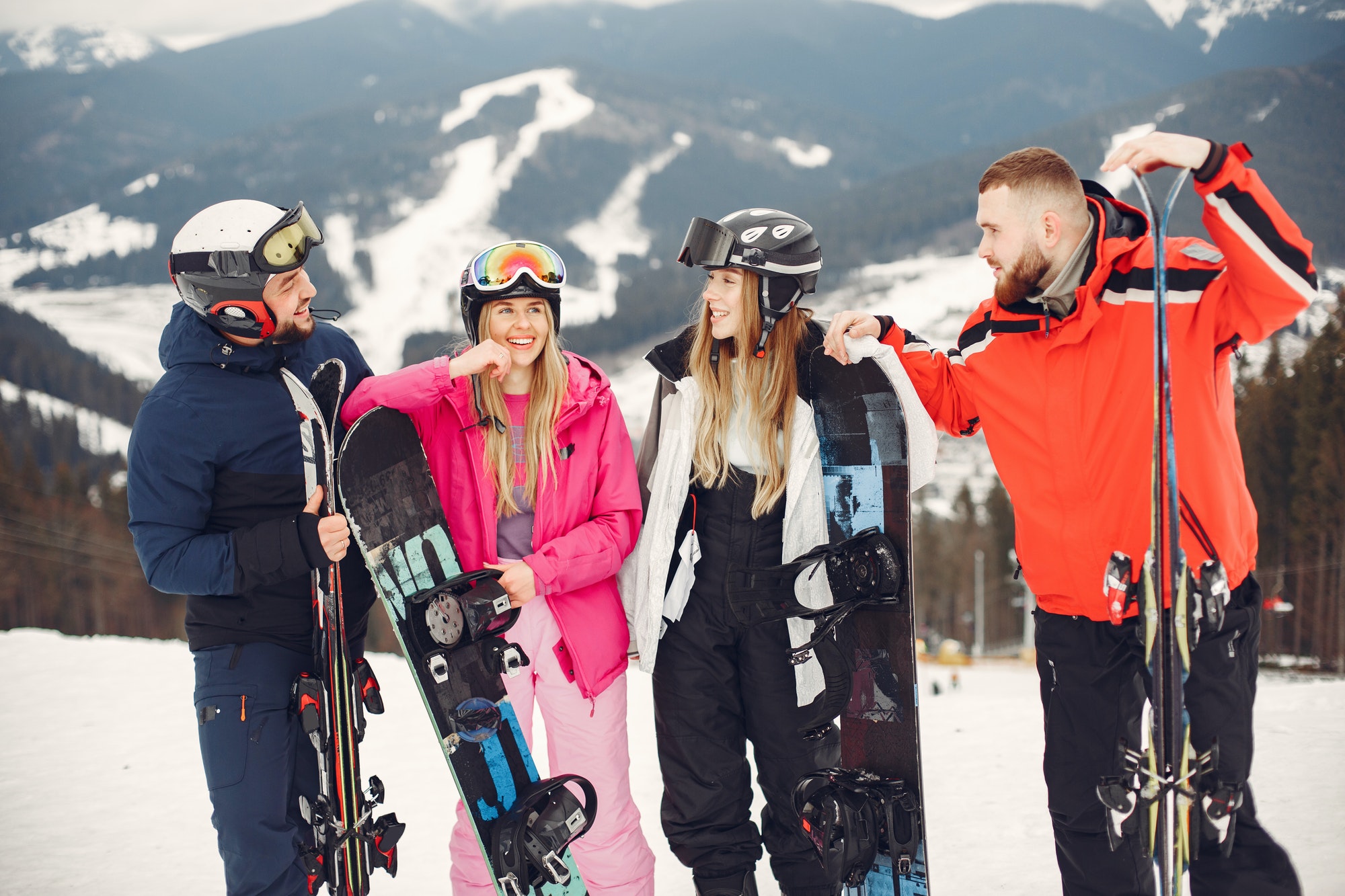 People snowboarding in the mountains with the snowboard.jpg